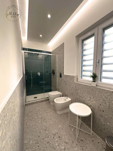 a bathroom with a toilet and a shower and a sink at B&B Villa Milly in Frattaminore