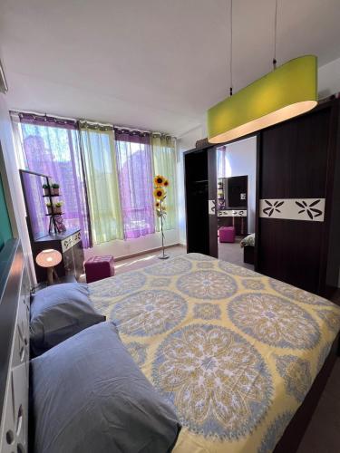 a bedroom with a large bed with a rug on it at Byout Beirut G3 in Beirut