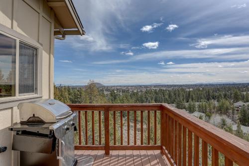 a balcony with a grill and a view of the mountains at Golden Butte in Bend