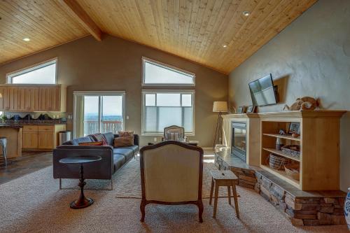 a living room with a couch and a fireplace at Golden Butte in Bend