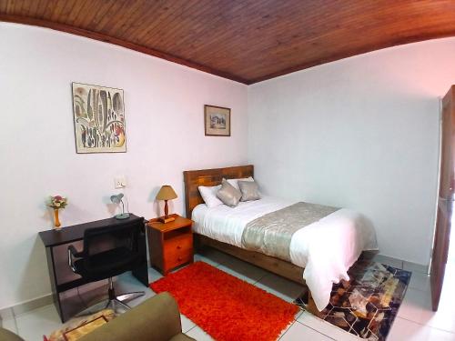 Postel nebo postele na pokoji v ubytování Millenium Manor Executive Homes