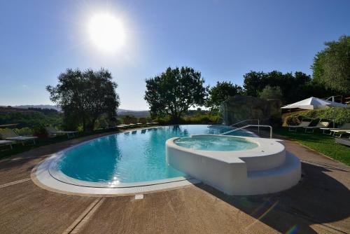 a large swimming pool in a yard at La Meridiana Bleisure Hotel in Perugia