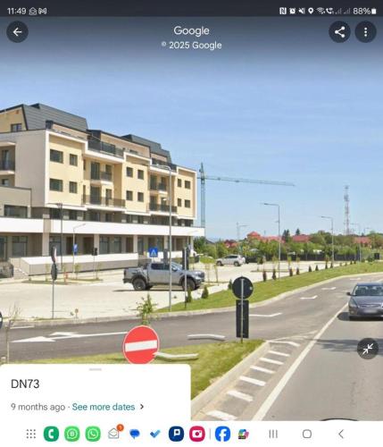 a view of a city street with a building at Rox Mountain View Apartament in Râşnov