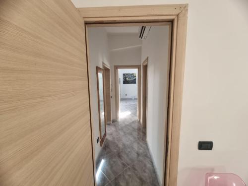a hallway of a house with a mirror at Il Gelso in Lecce