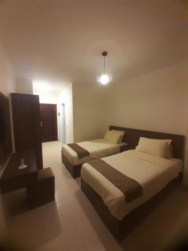Katil atau katil-katil dalam bilik di Traveller Namma bay