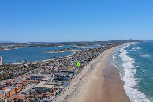 an aerial view of a beach and the ocean at 1Bd Ocean Waves Surf Parking in San Diego