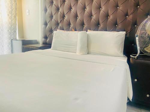 Ένα ή περισσότερα κρεβάτια σε δωμάτιο στο Saho Guesthouse