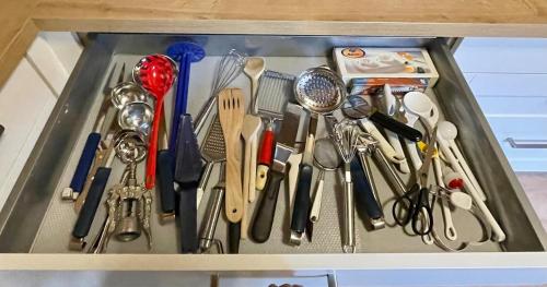 a drawer filled with lots of kitchen utensils at Traumhaus an der Lahn- Dreamhouse at River Lahn in Lahnstein