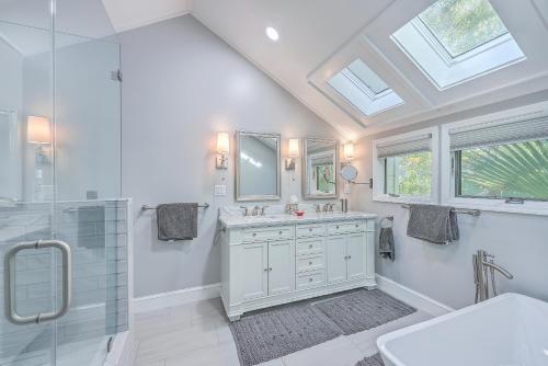 a white bathroom with a sink and a shower at 3032 Marsh Haven in Johns Island