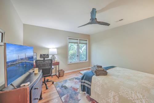 a bedroom with a bed and a flat screen tv at 3032 Marsh Haven in Johns Island