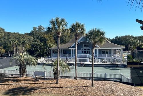 a house with palm trees in front of a tennis court at 3032 Marsh Haven in Johns Island