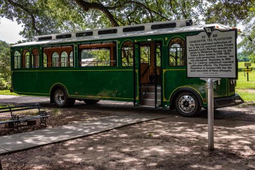 an old green bus parked next to a sign at 3032 Marsh Haven in Johns Island