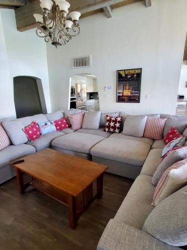 a living room with a couch and a coffee table at Moovalya Keys Riverfront Room for all in Parker