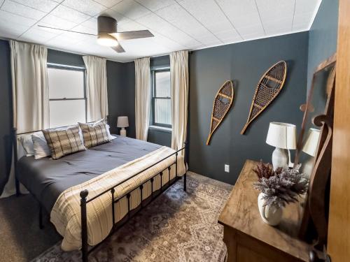a bedroom with a bed and a table in it at Mountain Meadow Retreat near Park City in Peoa