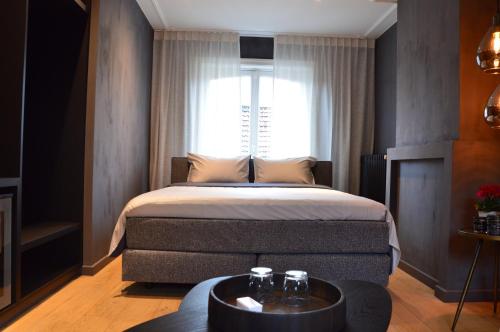 A bed or beds in a room at Amato-Brugge