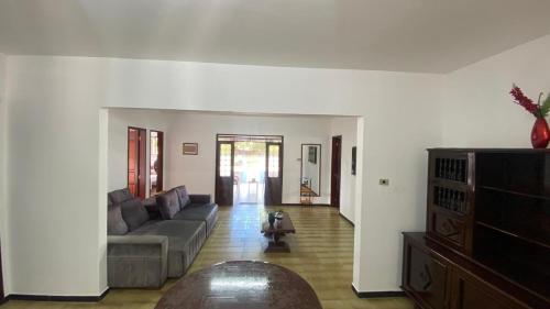 a living room with a couch and a table at Casa na Serra de Martins in Martins