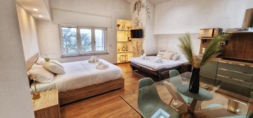 a bedroom with a bed and a couch and a table at Vista Paradiso in Buronzo