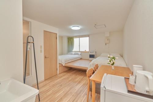 Ένα ή περισσότερα κρεβάτια σε δωμάτιο στο The Stay 細雪