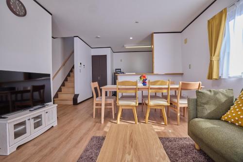 a kitchen and dining room with a table and chairs at APROStay富士河口湖松山16 in Fujiyoshida