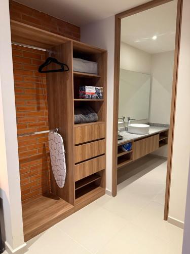 a bathroom with a sink and a mirror at Stylish New Loft in Financial Zone and Downtown in Guadalajara