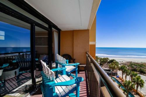 a balcony with chairs and a view of the beach at Cool Coast Ocean View Resort Studio in Myrtle Beach