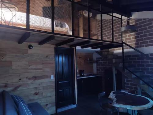 a bedroom with a bunk bed in a room at Jlumal Cabañas in San Cristóbal de Las Casas