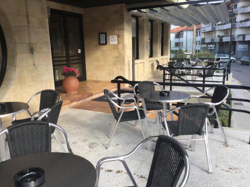 a group of tables and chairs on a patio at Montemar in Llanes