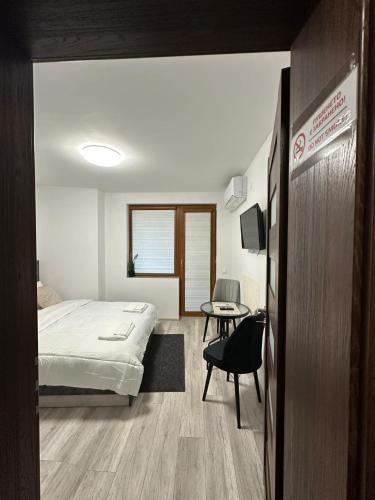 a hospital room with a bed and a table at Star in Varna City