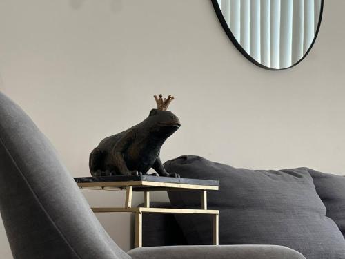 a statue of a sheep sitting on top of a couch at The Signature at CityPlace in Toronto