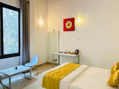 Postel nebo postele na pokoji v ubytování TridentKandy
