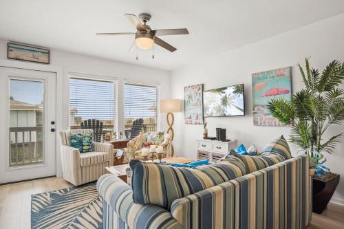 a living room with a couch and a ceiling fan at Casa Sea-Esta - OCEAN VIEWS in Port Aransas
