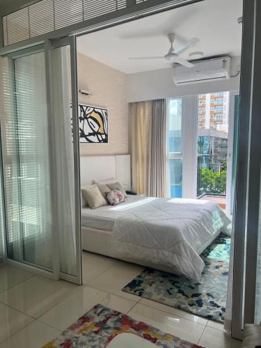 a bedroom with a bed and a large window at Full 1 BHK near Aster hospital hebbal in Bangalore