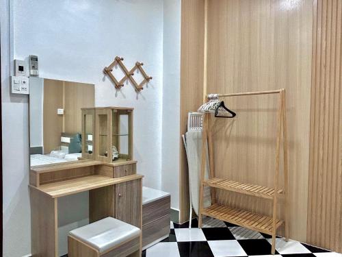 a bathroom with a sink and a toilet and a mirror at Can Tho Home & Apartment 1 in Can Tho