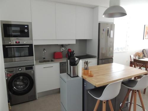 Η κουζίνα ή μικρή κουζίνα στο Apartamento confortable
