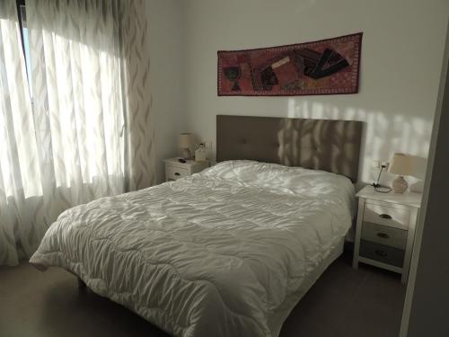 Ένα ή περισσότερα κρεβάτια σε δωμάτιο στο Apartamento confortable