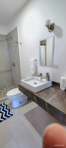 a bathroom with a sink and a toilet at Condo located 8 min from DT & 15 min from Airport in San José del Cabo