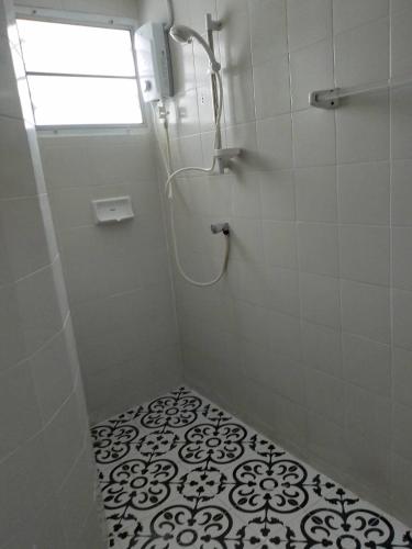 a bathroom with a shower with a window at Homestay Riceberry Ramintha in Ban Baen Phichit