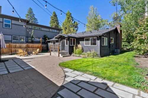 a house with a patio and a yard at NW Nest 30 Day Minimum in Bend