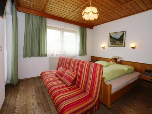 Ένα ή περισσότερα κρεβάτια σε δωμάτιο στο Apartment in Hippach near Horbergbahn
