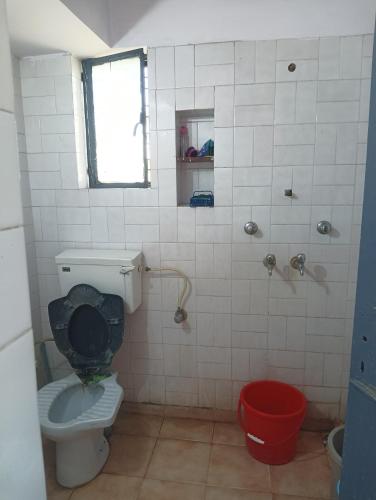 a bathroom with a toilet and a shower at New sharma homestay in Prayagraj