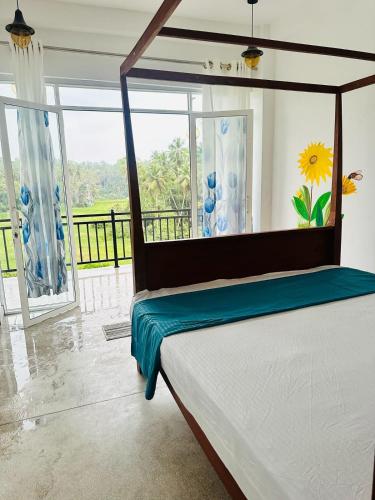 a bedroom with a bed and a large window at Southern grace unawatuna in Unawatuna
