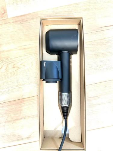 a charging cable is plugged into a box at Ueno new villa in Tokyo