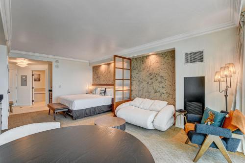 a hotel room with two beds and a table at The Rosé II MGM Signature Studio Suite Tower 3 in Las Vegas