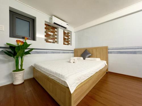 Ένα ή περισσότερα κρεβάτια σε δωμάτιο στο Can Tho Home & Apartment 3