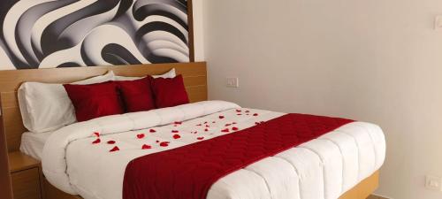 Postel nebo postele na pokoji v ubytování Hotel Eden Palace