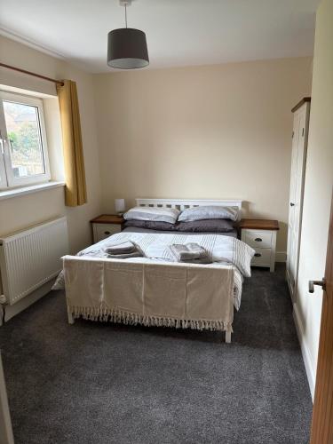 a bedroom with a bed and a window at Perfect bikers retreat or family get away in Monmouth