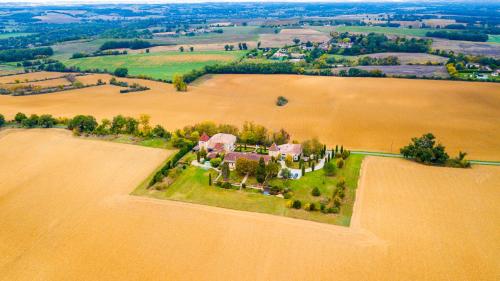 an aerial view of a house on an island in a field at Propriété Le Monneton in Sainte-Christie