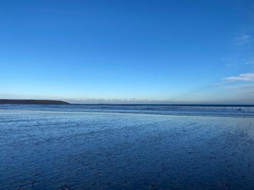 a beach with the ocean in the background at Sunrise at The Bay Filey in Filey