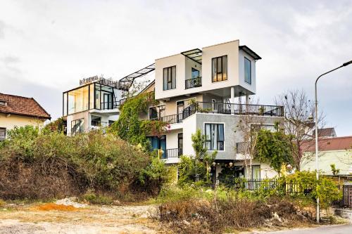 an apartment building on the side of a street at Be Youth Villa Đà Lạt - O'TEL in Da Lat