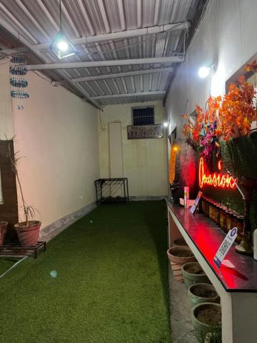 an empty room with a green floor in a room at Occasions stay in Jammu